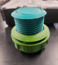 60 mm button stacked on top of the larger 90 mm button